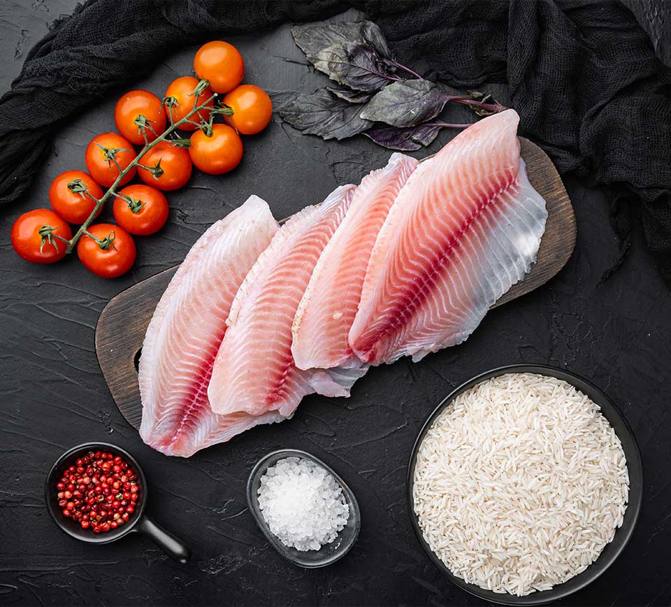 white-fish-fillet-with-basmati-rice-cherry-tomatoes-ingredients-black-background-top-view